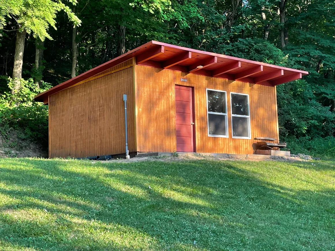 This cabin is detached from the lodge--a 300 sq ft original (remodeled) YMCA camp cabin that sleeps 12 in 6 bunk beds