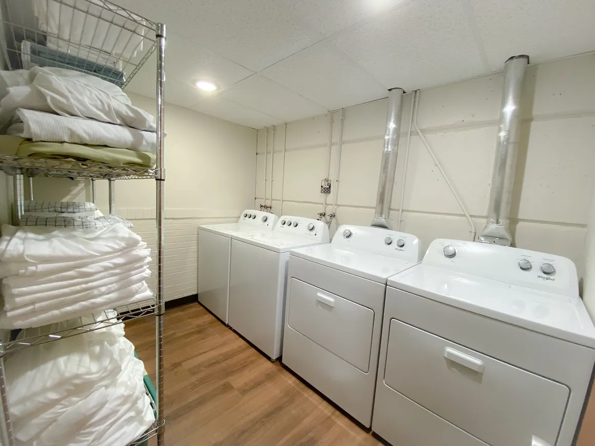 Main-level laundry & linen room (additional washer/dryer set upstairs)